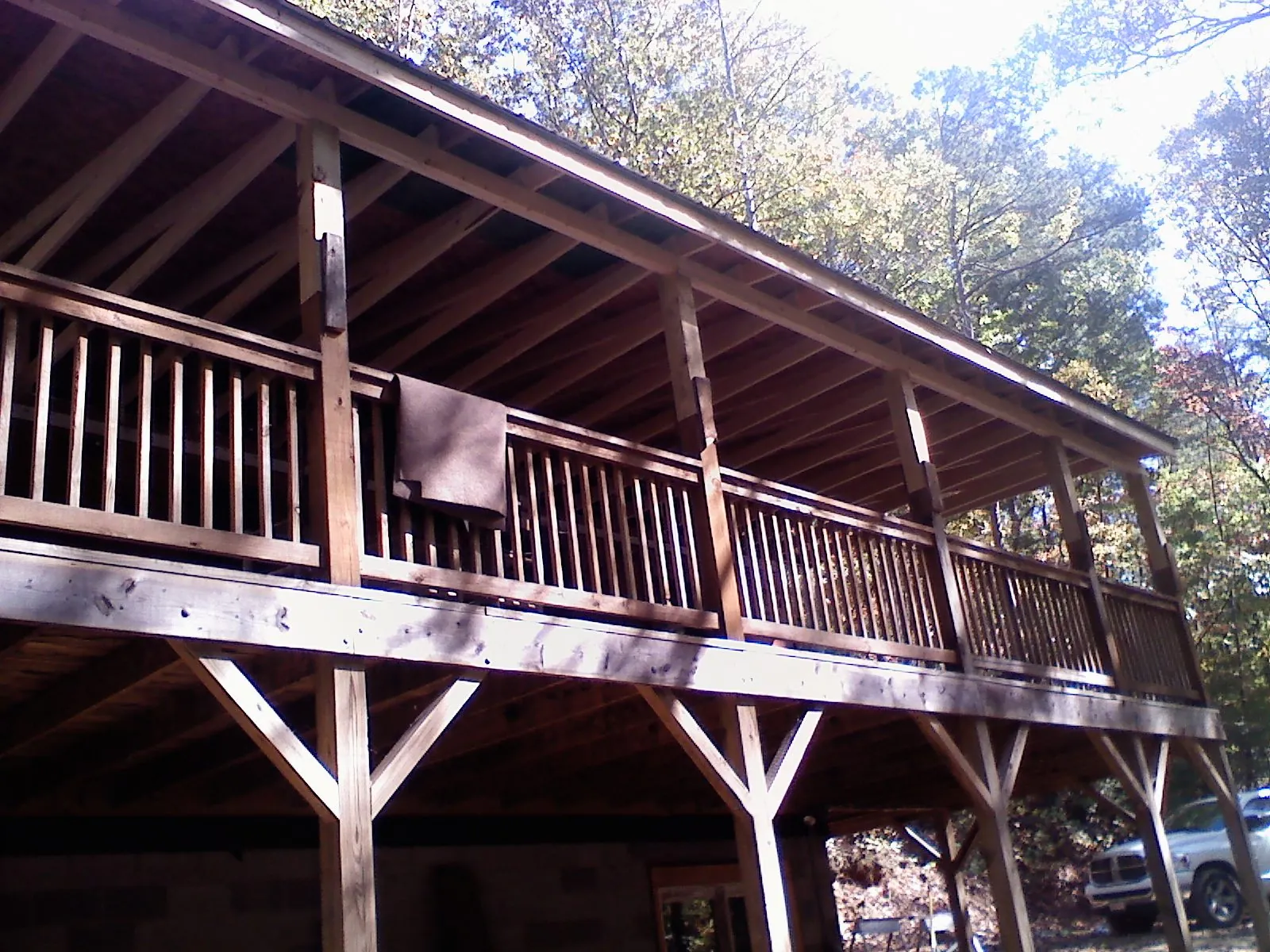 Timber framing under a new elevated porch and deck in Selmer